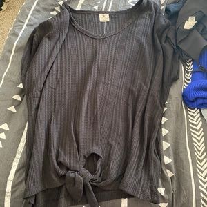 black shirt sleeve with tie in front